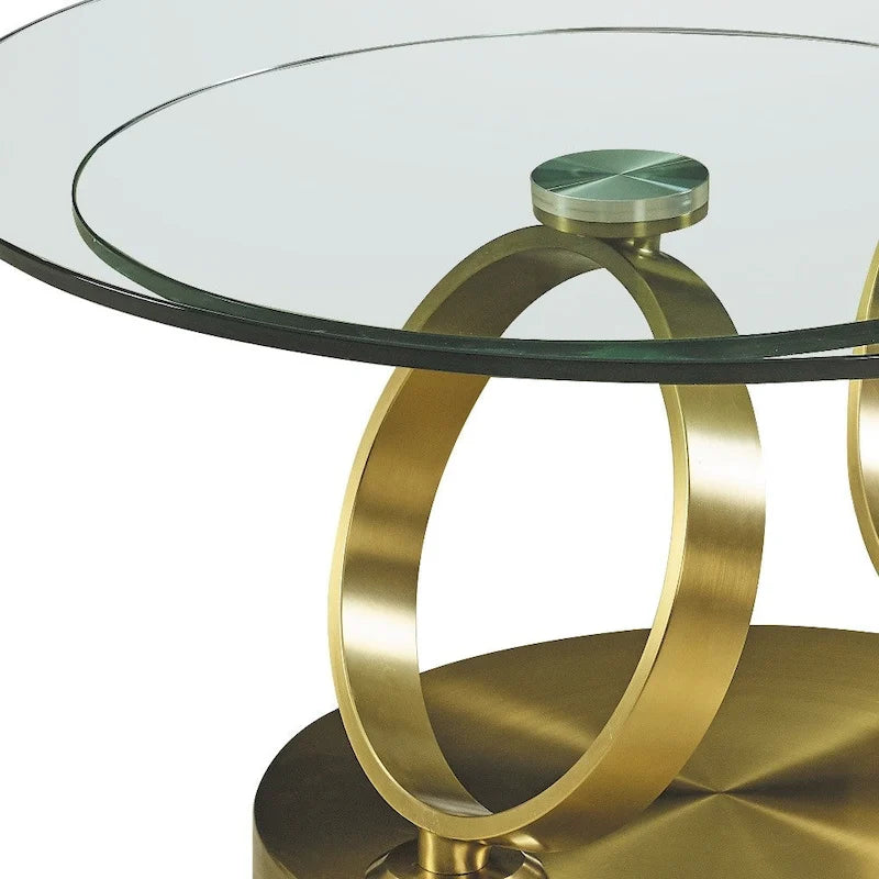 Runder Couchtisch mit transparenter Glasplatte und ringförmigem Untergestell aus Goldmetall