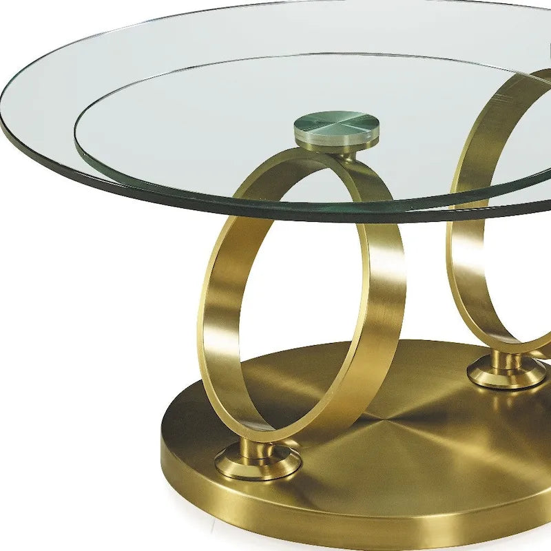 Runder Couchtisch mit transparenter Glasplatte und ringförmigem Untergestell aus Goldmetall